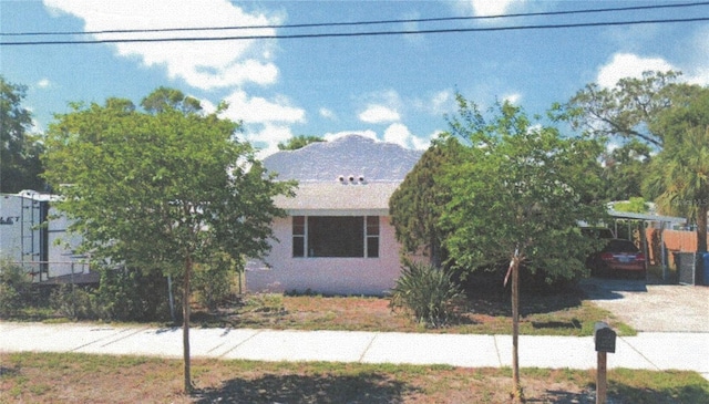 view of front of property with a carport