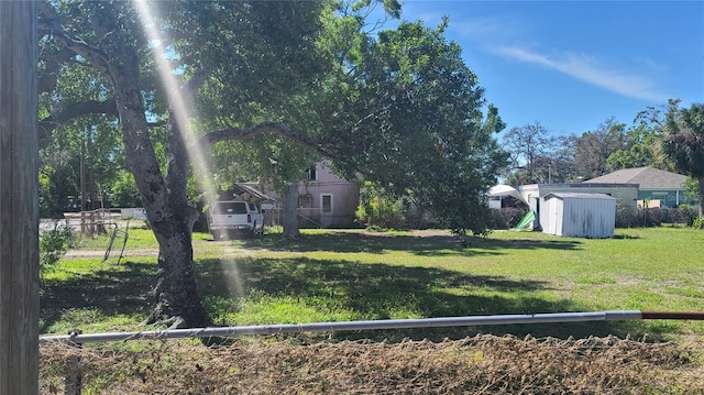 509 Rosery Rd NW, Largo, FL 33770 - view of yard featuring a storage shed, fence, and an outdoor structure