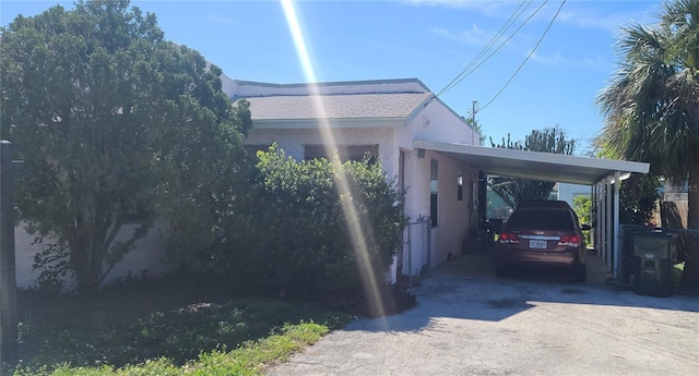 509 Rosery Rd NW, Largo, FL 33770 - view of home's exterior featuring a carport and driveway