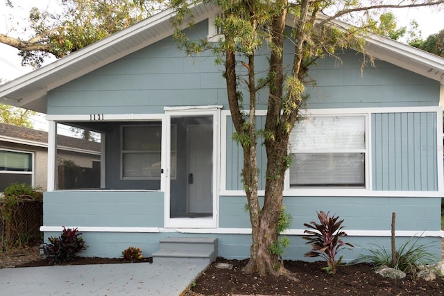 view of front of property with a sunroom