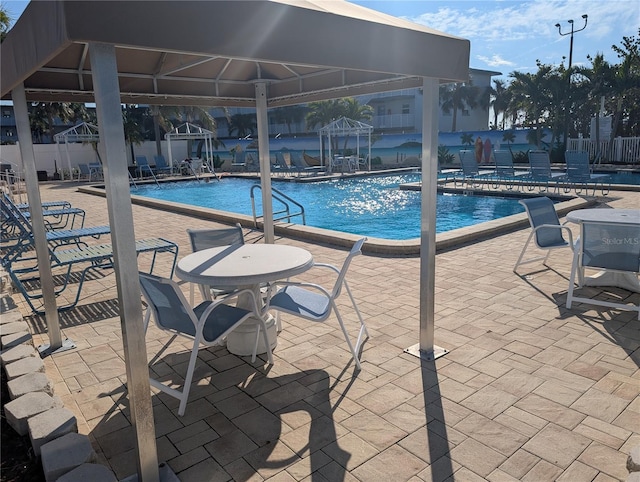 view of pool featuring a gazebo and a patio