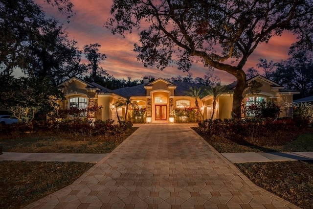 mediterranean / spanish house featuring french doors