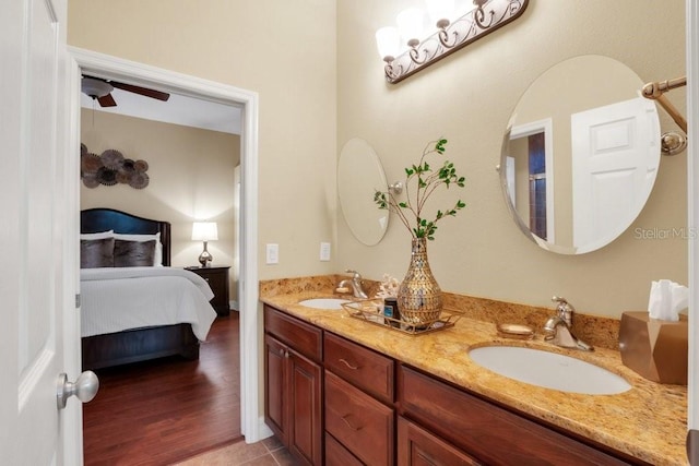 bathroom featuring tile patterned floors, ceiling fan, and vanity