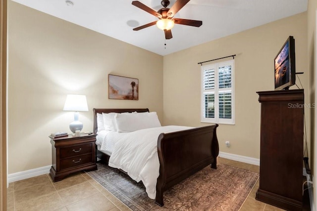 bedroom featuring light tile patterned floors and ceiling fan