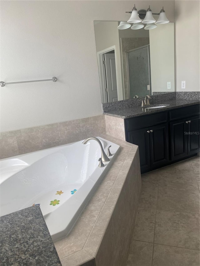 full bathroom with tile patterned flooring, a shower stall, vanity, and a bath