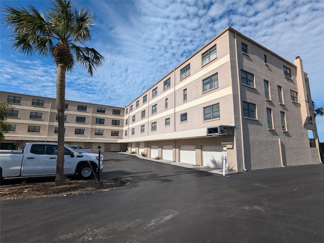 view of property with community garages