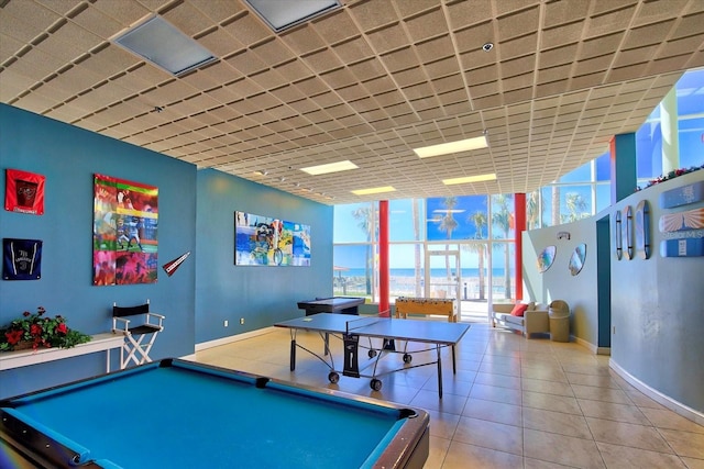 recreation room featuring floor to ceiling windows, a water view, and pool table