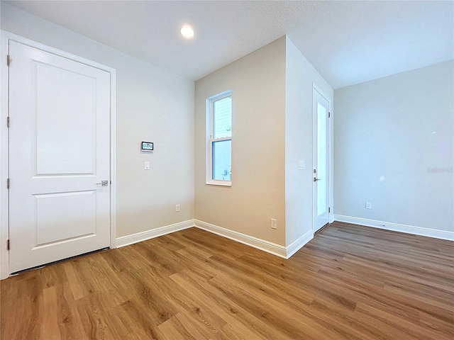 empty room featuring wood-type flooring