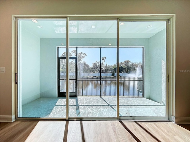 doorway to outside featuring hardwood / wood-style flooring