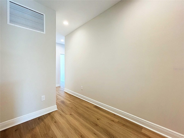 hallway with light hardwood / wood-style flooring