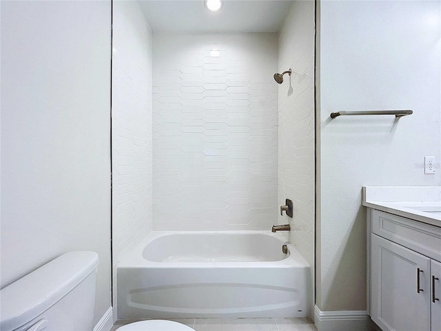 full bathroom featuring tiled shower / bath combo, toilet, and vanity