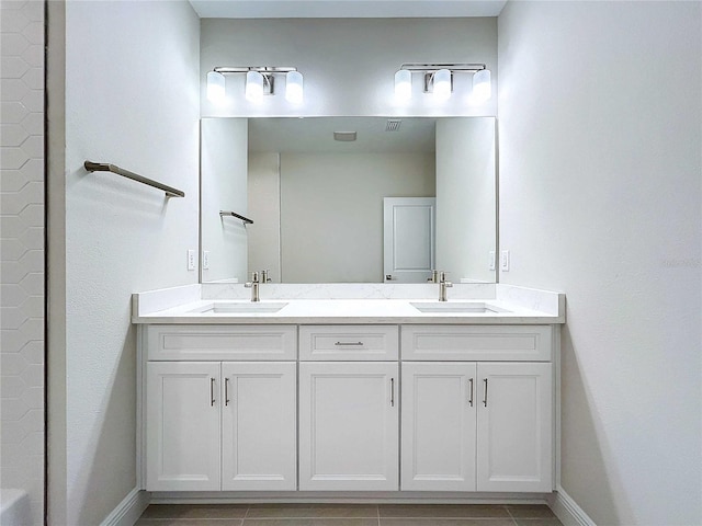 bathroom with vanity and tile patterned floors