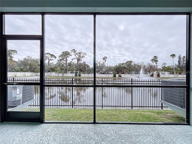 interior space with a water view and a wealth of natural light