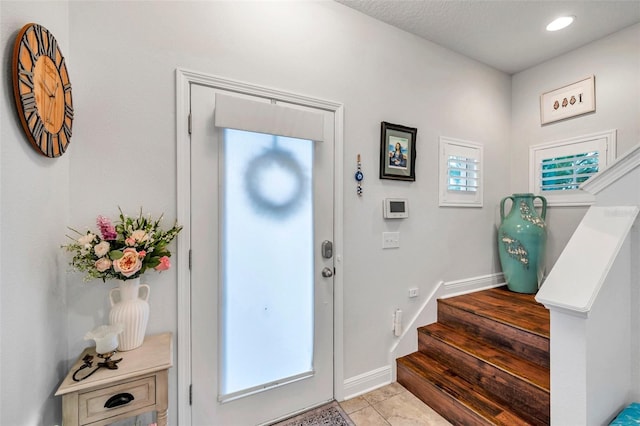 foyer with light tile patterned floors