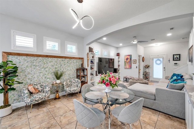 tiled dining room featuring ceiling fan