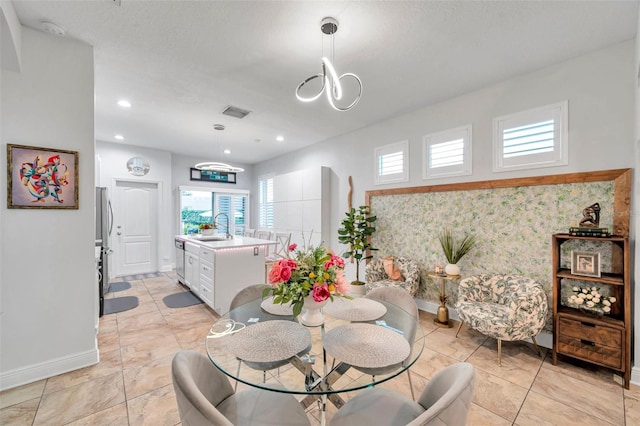 dining space featuring sink