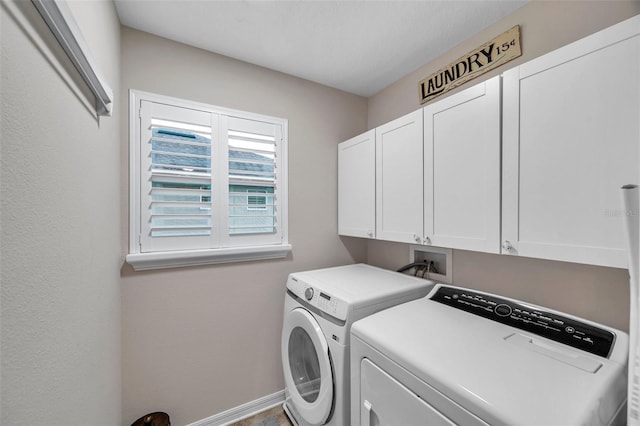 laundry room with cabinets and independent washer and dryer