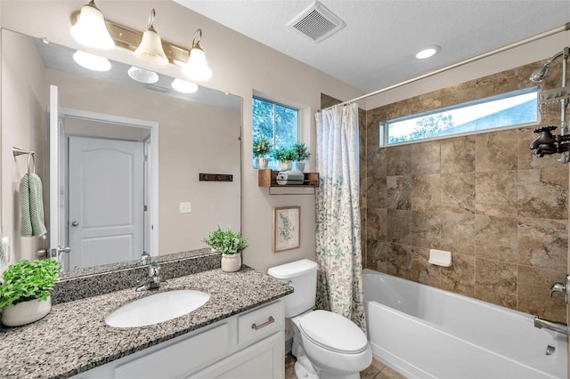 full bathroom with shower / bath combo, vanity, a textured ceiling, and toilet