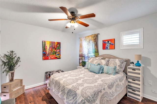 bedroom featuring a textured ceiling, dark hardwood / wood-style flooring, and ceiling fan