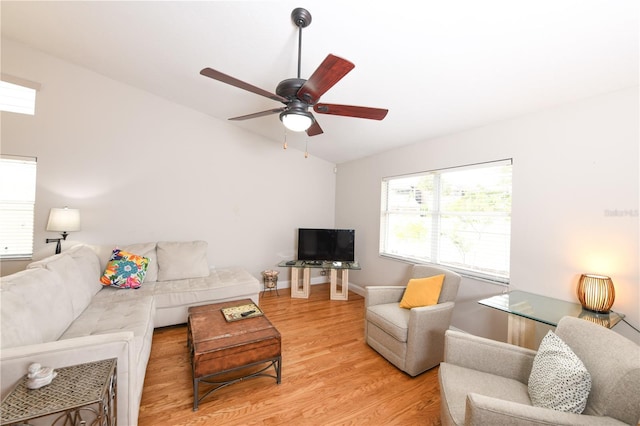 living room with vaulted ceiling, ceiling fan, and light hardwood / wood-style floors