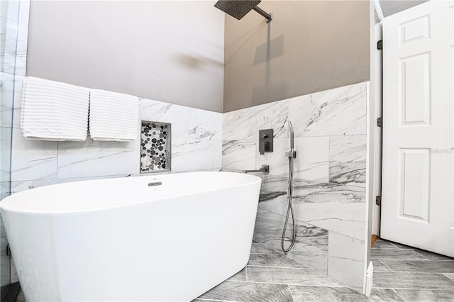 bathroom featuring tile walls and shower with separate bathtub