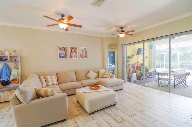 living room featuring ceiling fan and ornamental molding