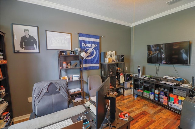 office with hardwood / wood-style floors, ornamental molding, and a textured ceiling