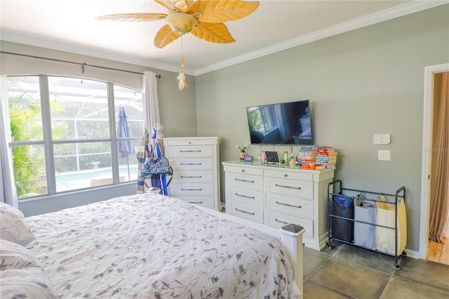 bedroom with ceiling fan, dark tile patterned flooring, and ornamental molding