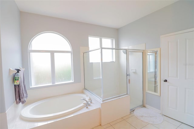 bathroom featuring separate shower and tub, tile patterned floors, and a healthy amount of sunlight