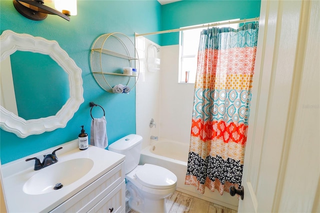 full bathroom with vanity, toilet, and shower / tub combo