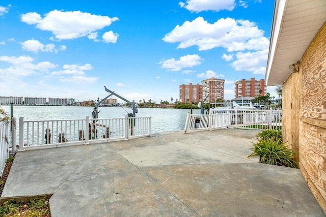 view of patio with a water view