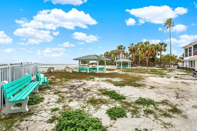 exterior space featuring a gazebo and a water view