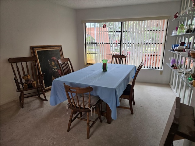 view of carpeted dining space