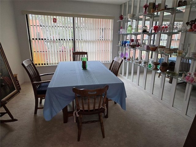 view of carpeted dining space