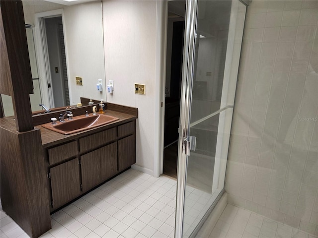 bathroom with vanity, an enclosed shower, and tile patterned floors