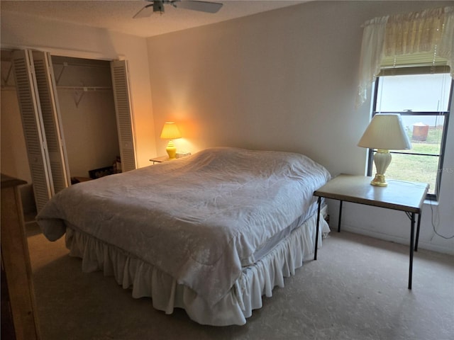 bedroom with ceiling fan and a closet