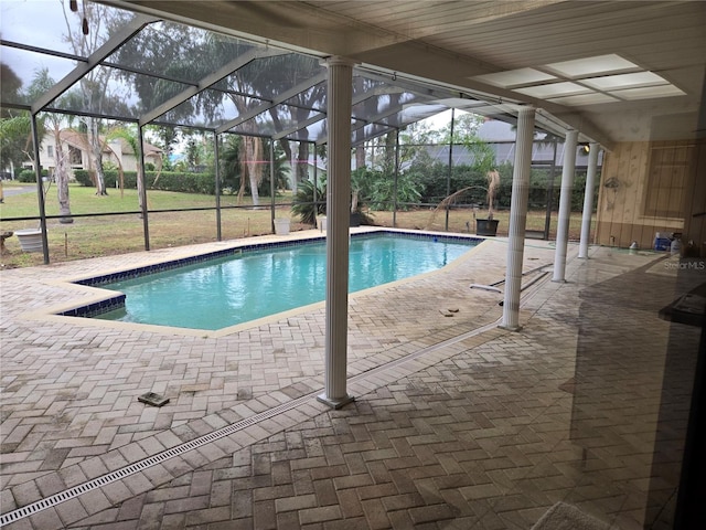 view of pool featuring a lanai and a patio