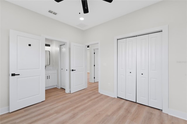 unfurnished bedroom featuring baseboards, visible vents, a ceiling fan, light wood-style flooring, and a closet