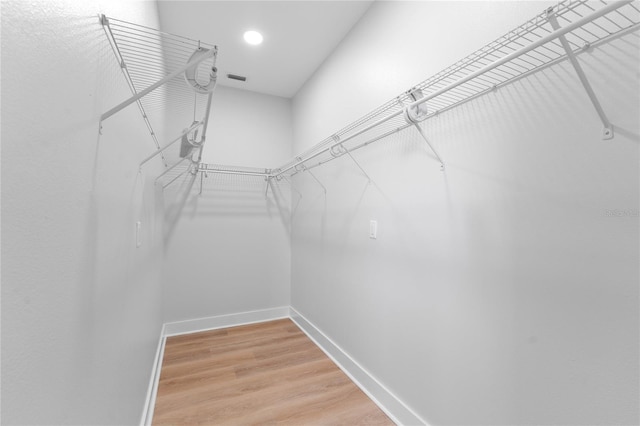 spacious closet featuring wood finished floors