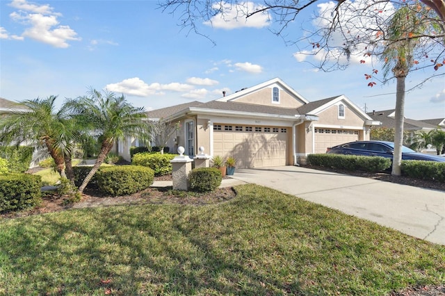 ranch-style house featuring a garage and a front lawn