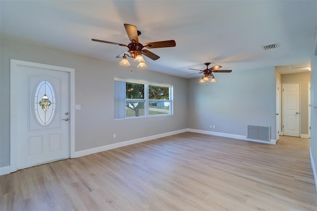 foyer featuring light wood-type flooring and ceiling fan