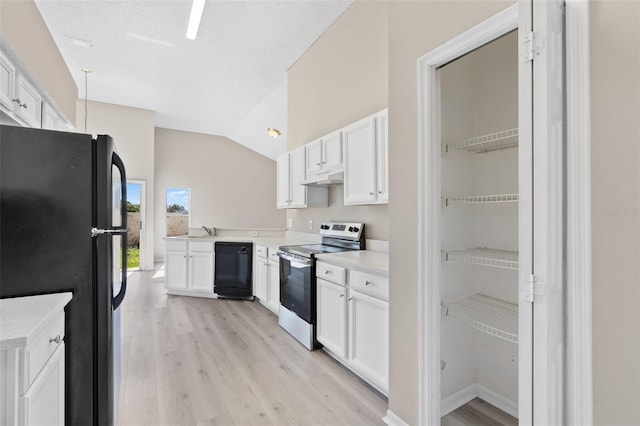 kitchen featuring white cabinetry, black appliances, lofted ceiling, and light wood-type flooring