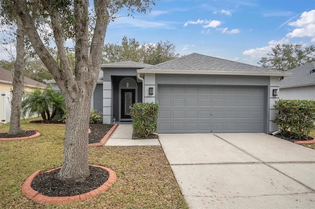 single story home with a front lawn and a garage