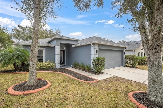 view of front of house with a front lawn and a garage