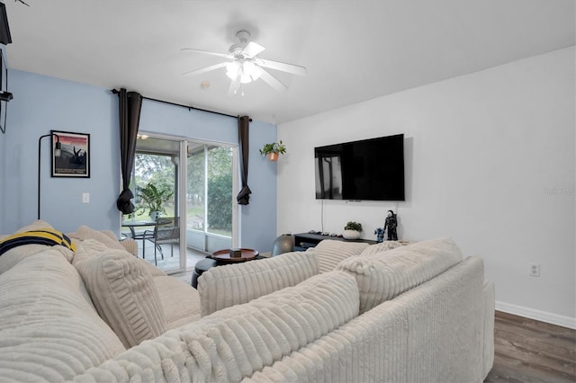 living room with ceiling fan and wood-type flooring