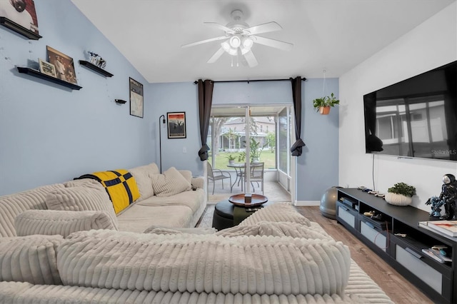 living room with ceiling fan and light wood-type flooring