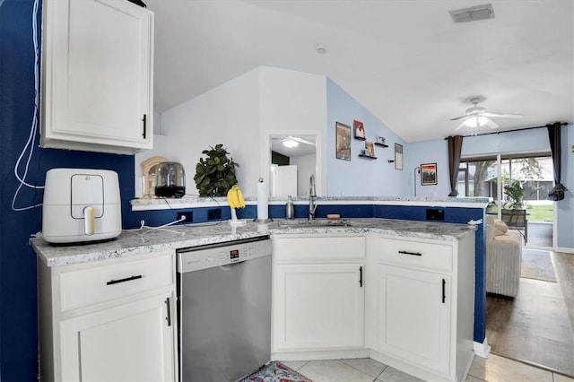 kitchen featuring white cabinets, stainless steel dishwasher, and kitchen peninsula