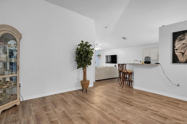 interior space with ceiling fan and light wood-type flooring