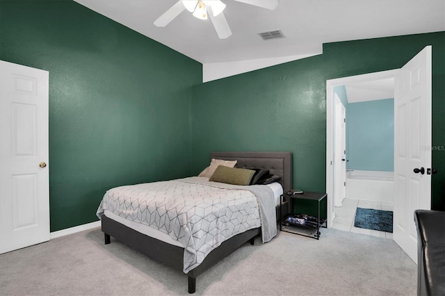 carpeted bedroom with vaulted ceiling and ceiling fan