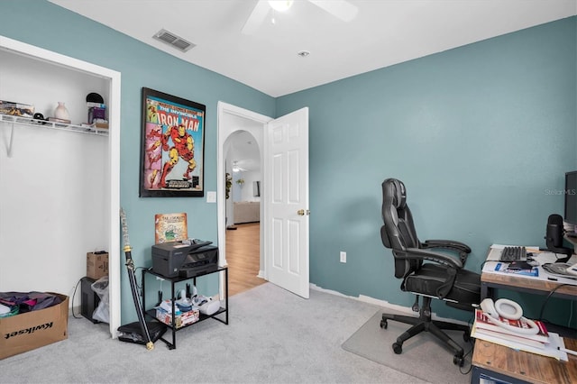 office featuring ceiling fan and light colored carpet